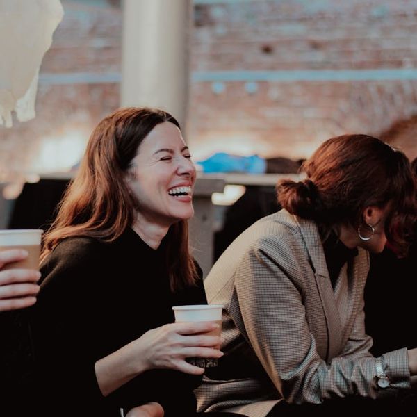 Diverse group of people smiling during a light activity session.